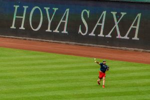 Nationals pitcher Max Scherzer warms up with "Hoya Saxa" sign behind him