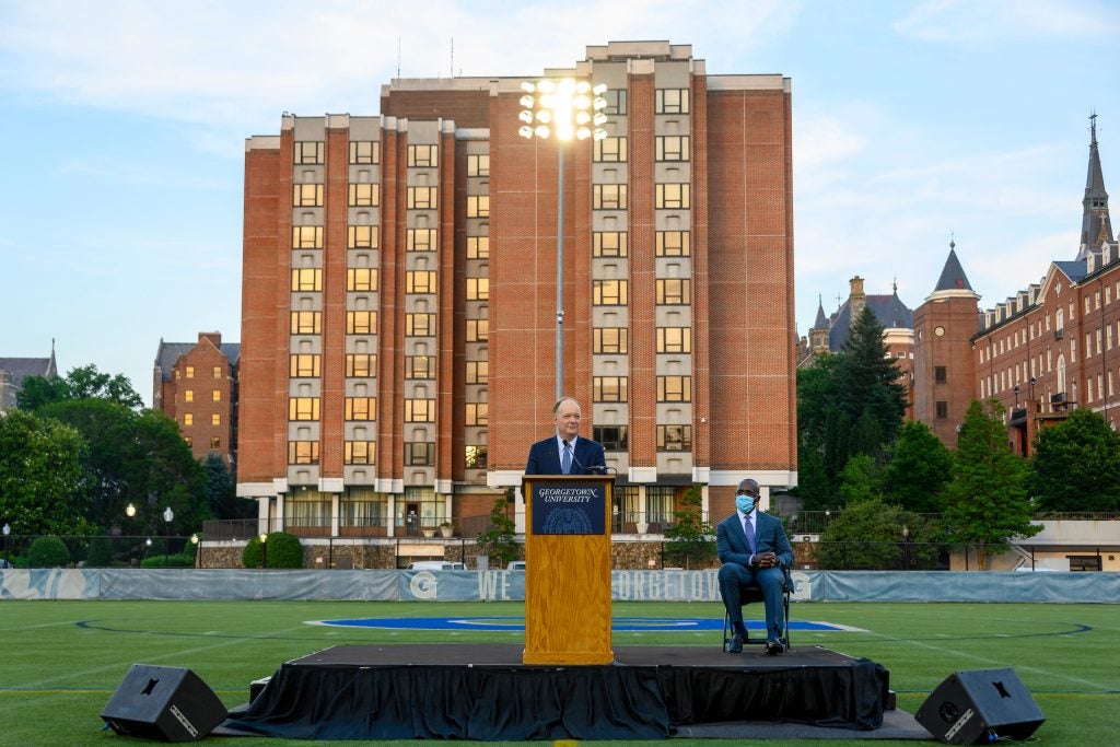 President DeGioia delivers a speech on Cooper field in front