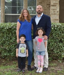 Timothy Torres with his wife and two children