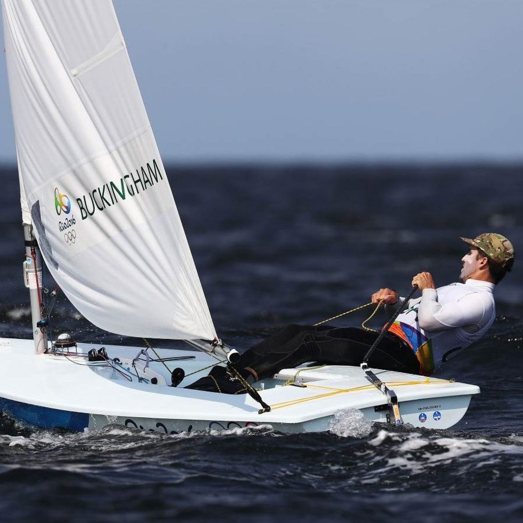 Charlie Buckingham leans back on a sailboat
