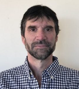 Headshot of Ophir Frieder wearing a blue gingham shirt