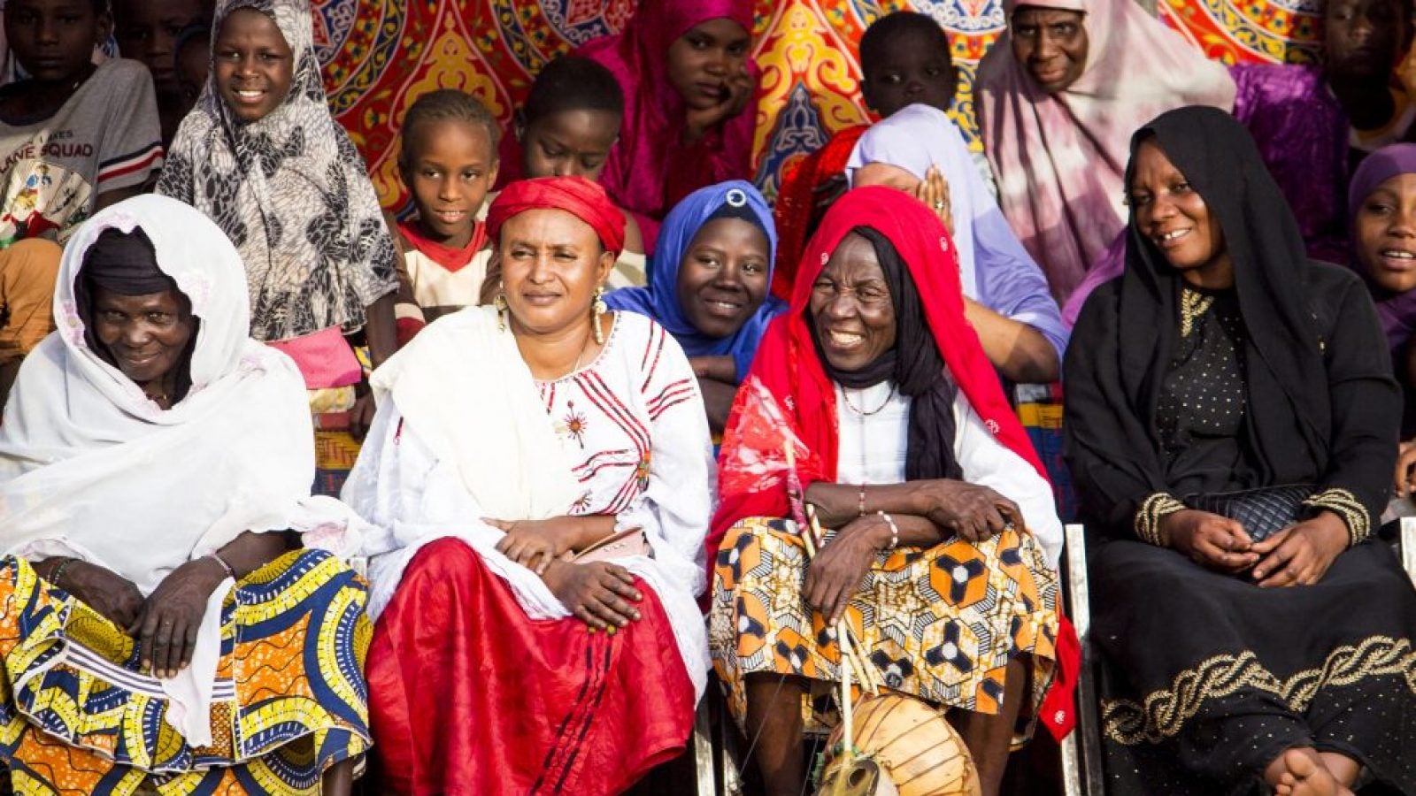 Community members gather to celebrate the final event of a USAID-supported youth empowerment project. Photo by Erica Frendach for USAID.