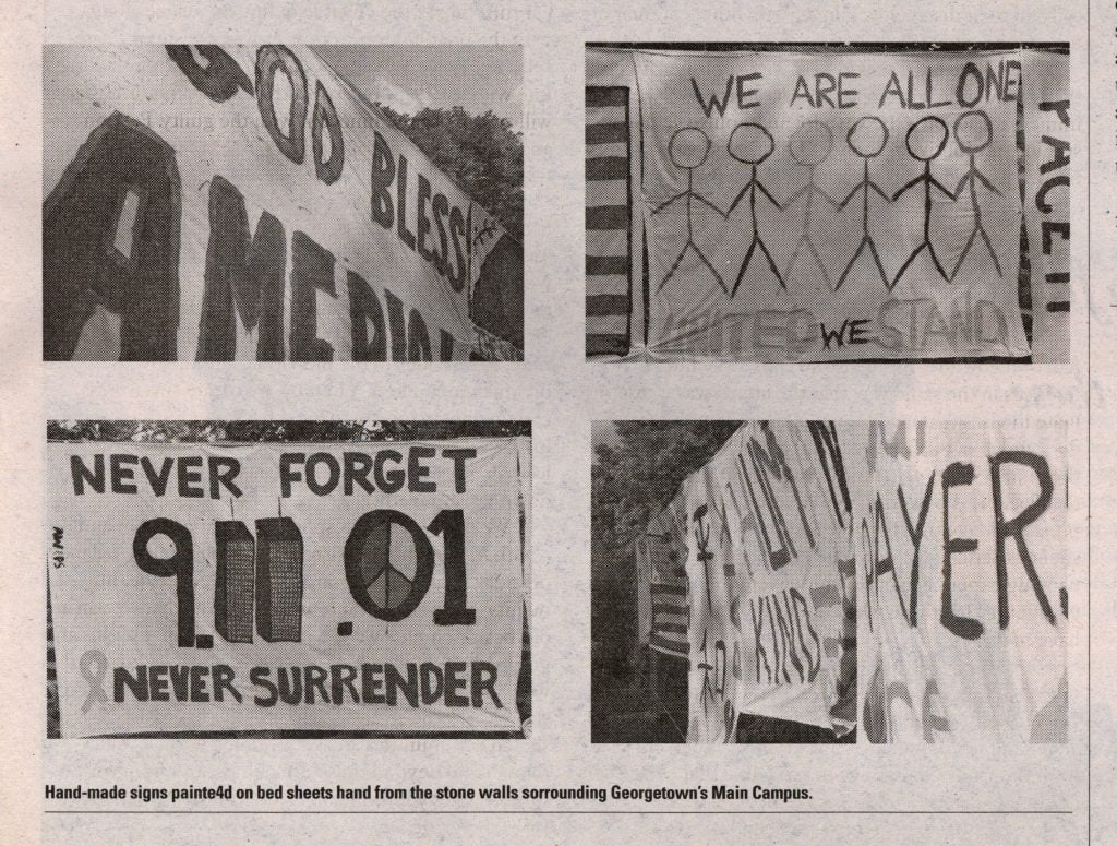 Four handmade signs conveying messages about 9/11