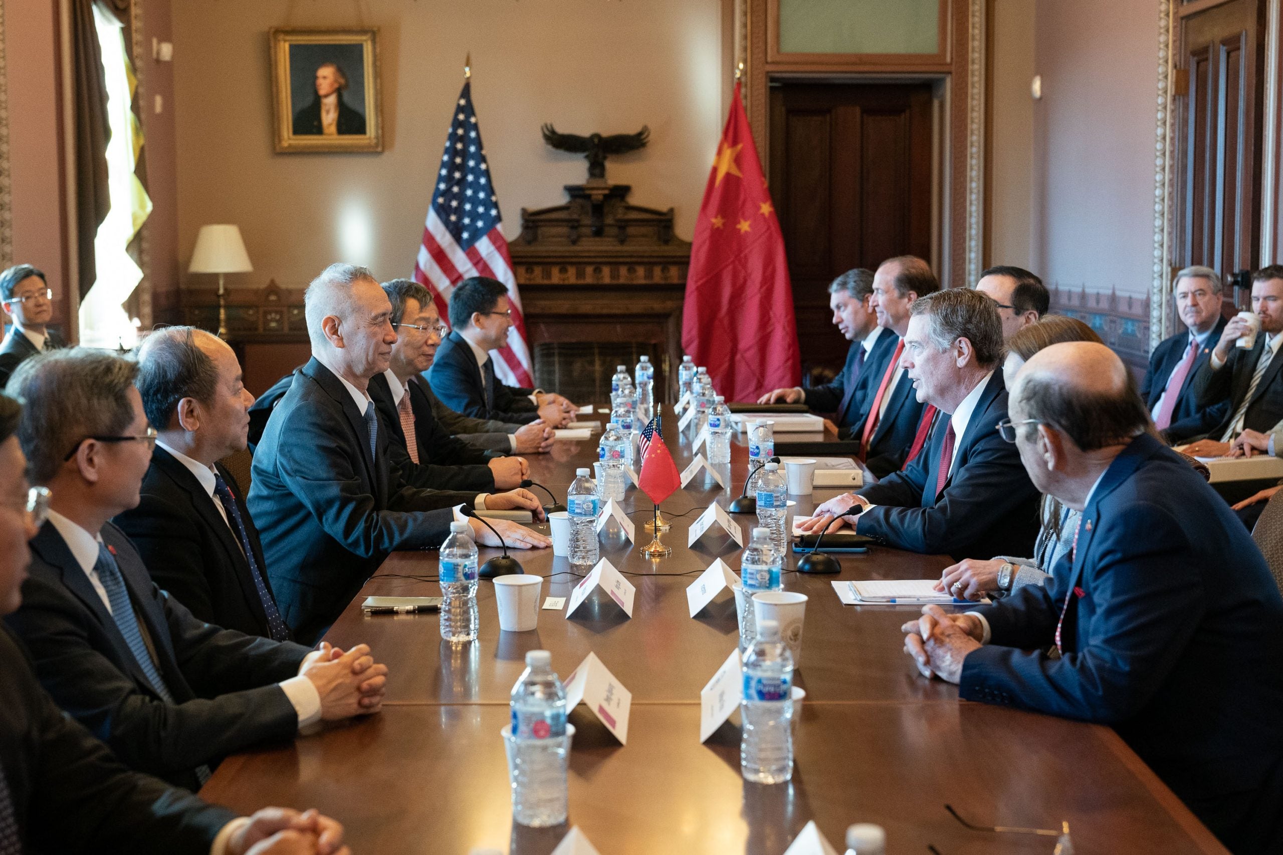 Amb. Robert Lighthizer and Chinese officials around a negotiation table