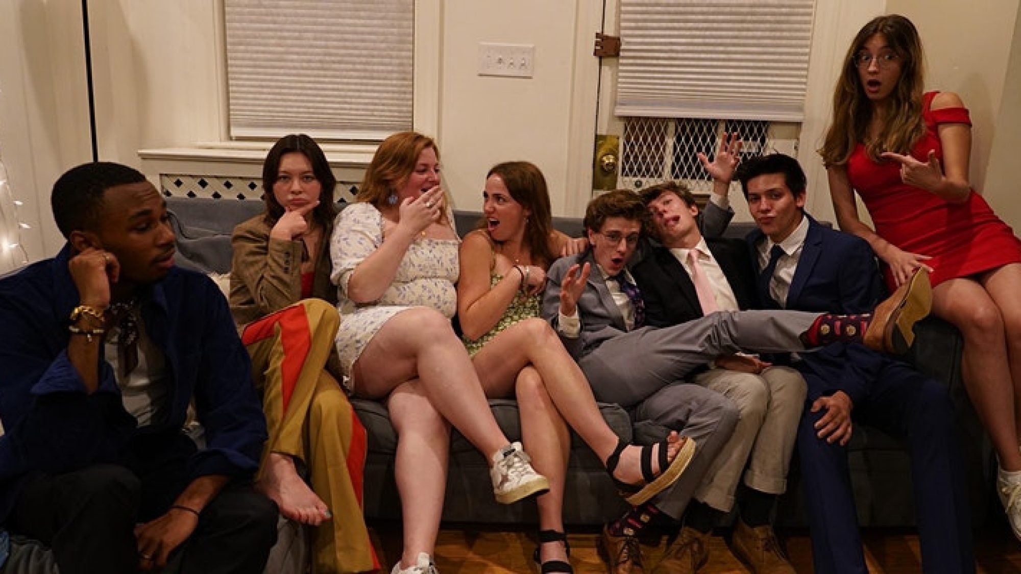 Members of GU Improv casually pile on a couch.