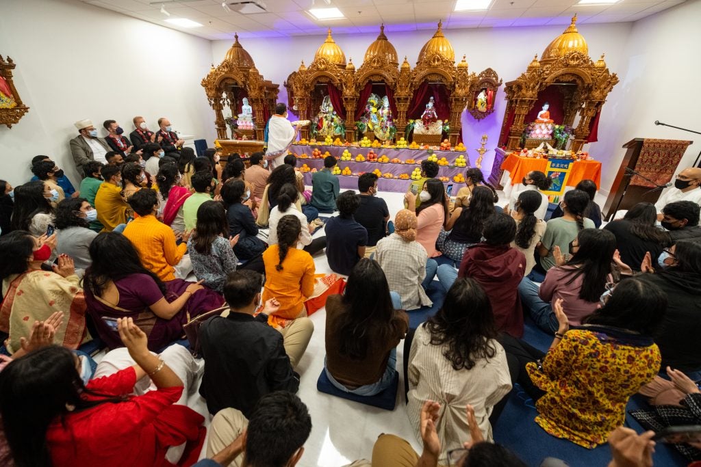 Students gather for the grand unveiling at the Dharmic Meditation Center.