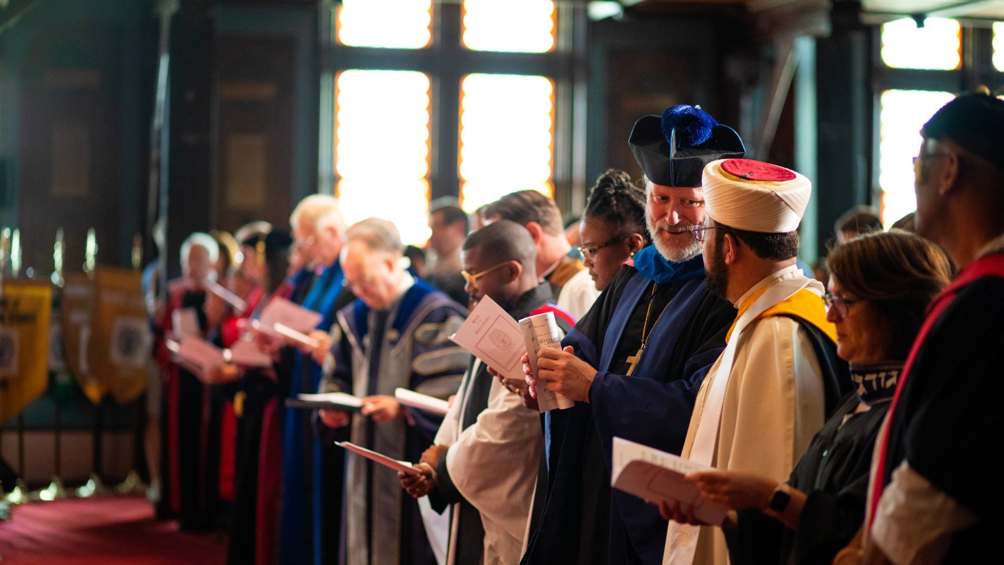 Chaplains in religious garments from different traditions interacting