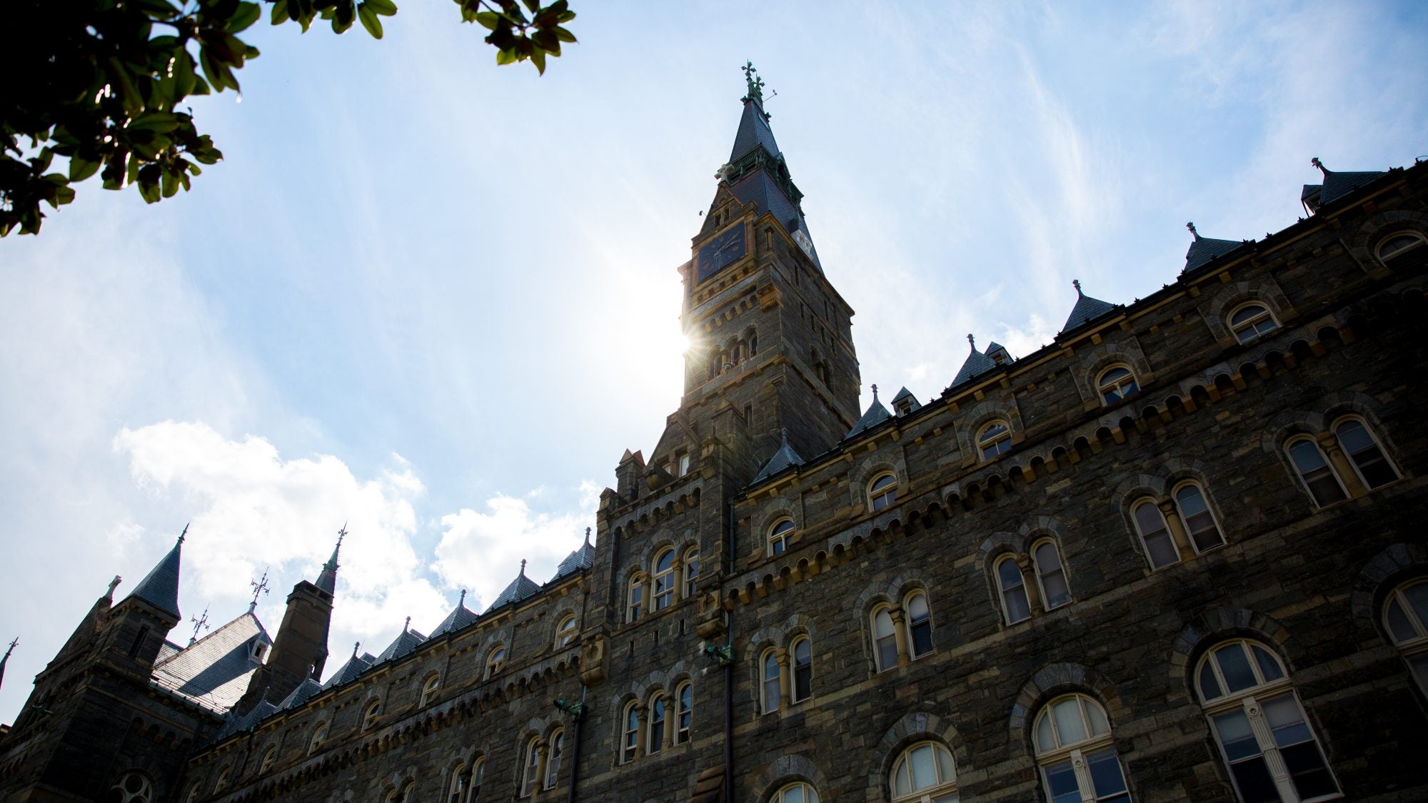 Sun behind Healy Hall