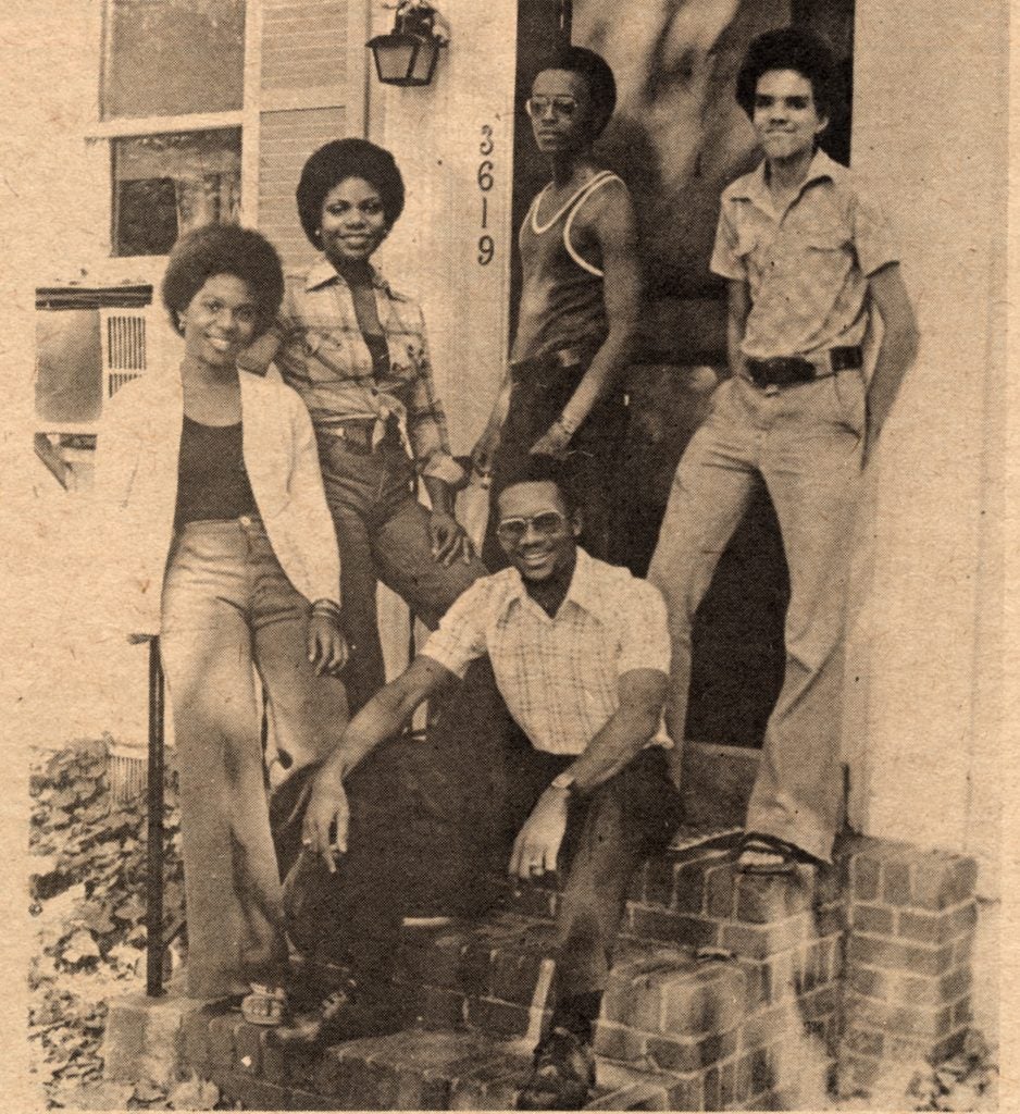 Newspaper image of five students outside of a Georgetown townhouse