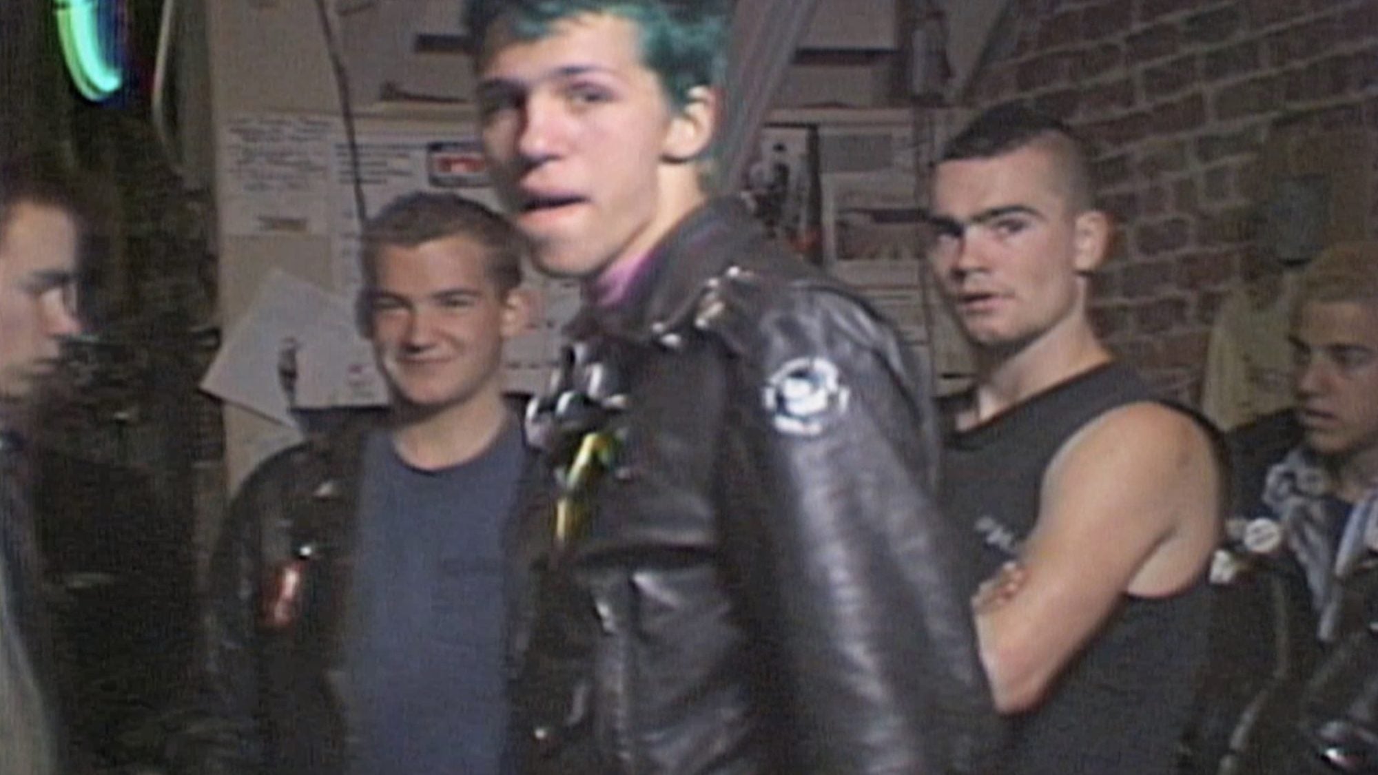 Group of people including punk vocalist Henry Rollins.