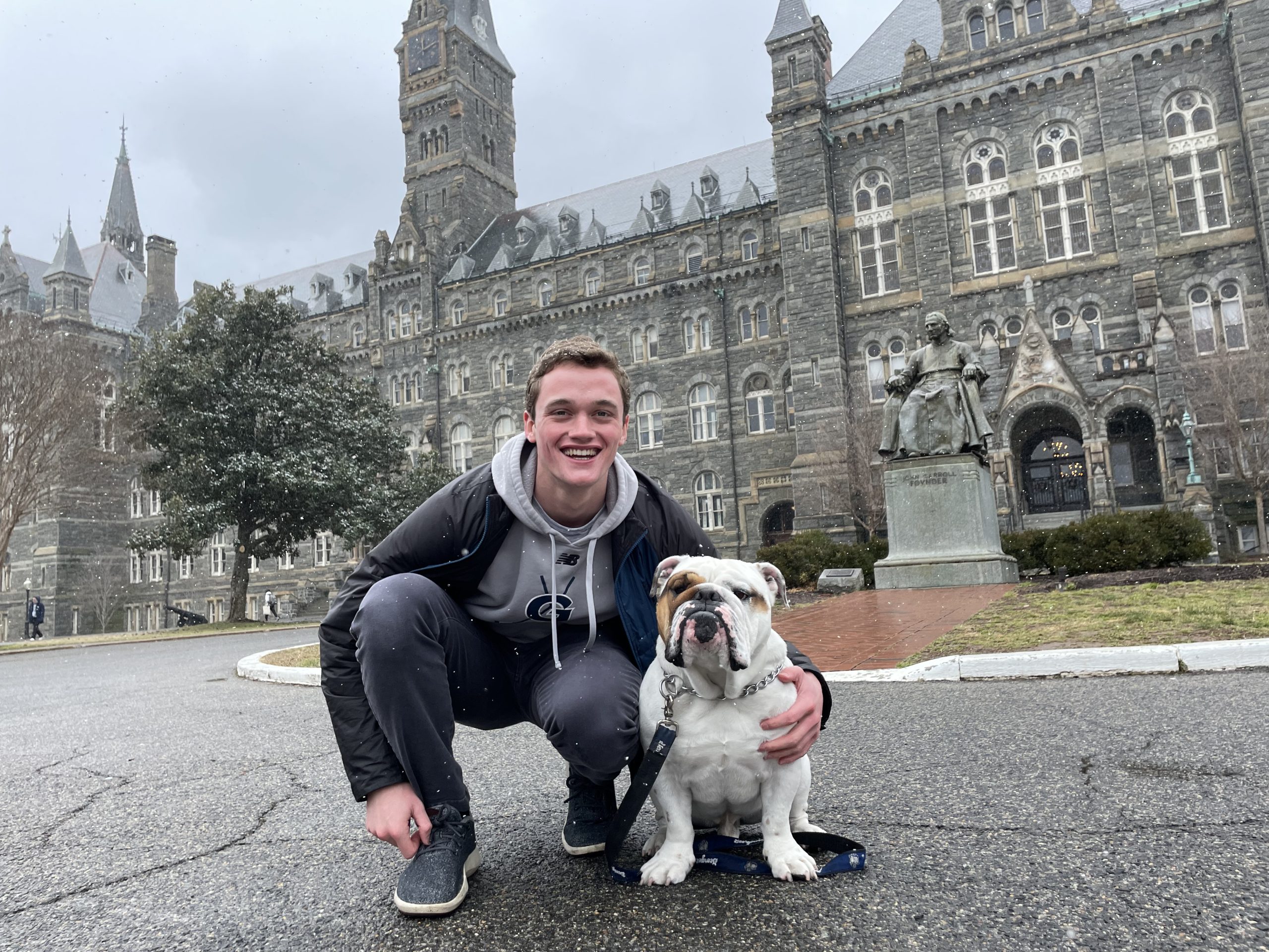 Jake with Jack the Bulldog in front of Healy Hall