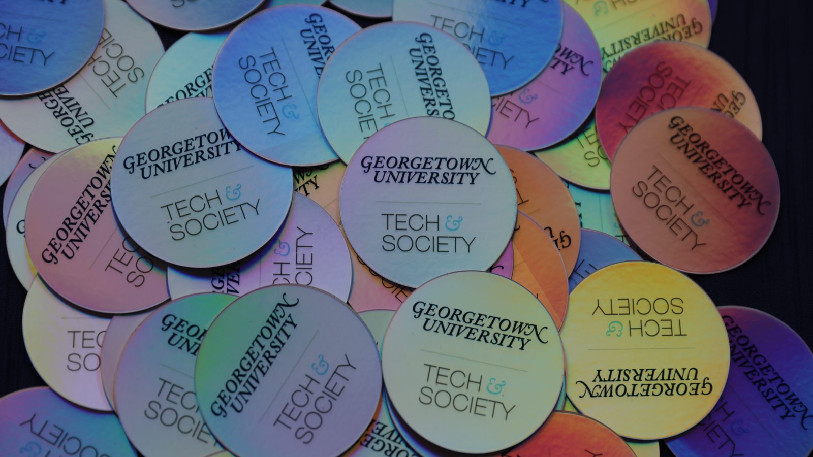 Multicolored stickers with the text &quot;Georgetown University Tech &amp; Society&quot;