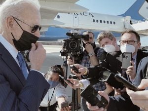 Perez participates in a press gaggle with President Biden outside of Air Force One.