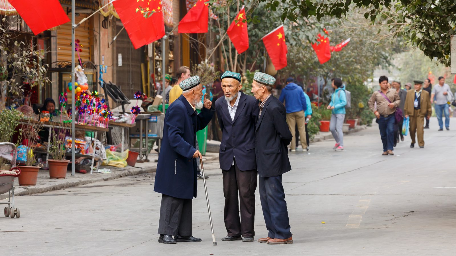 3 men talking in the street