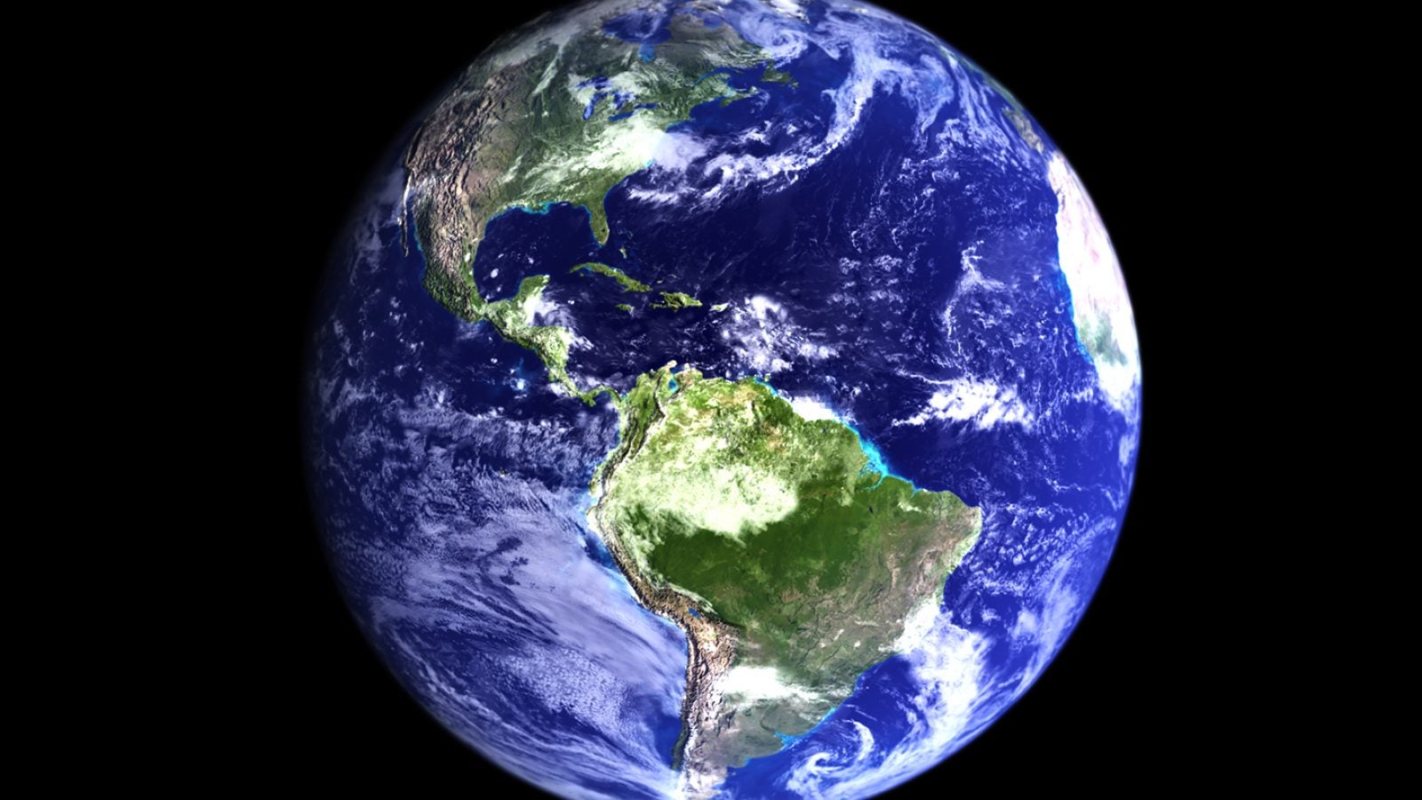 Planet earth viewed from black outer-space, with light cloud cover.