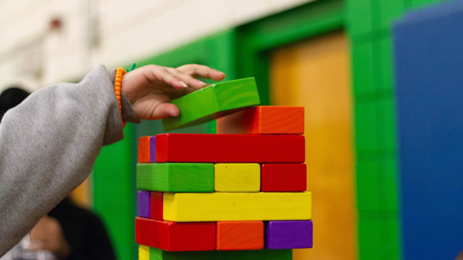 A picture of a child playing with blocks.
