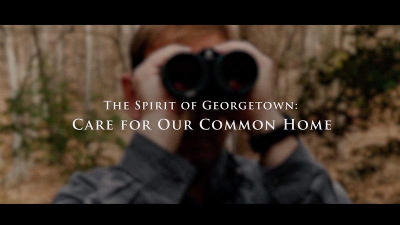 Pete Marra holds binoculars with the text &quot;Spirit of Georgetown: Care for Our Common Home&quot; overlaid