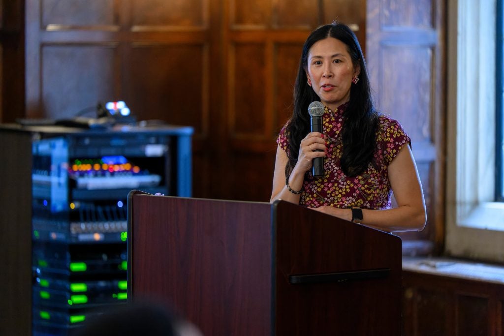 Susan Cheng speaks from behind a podium