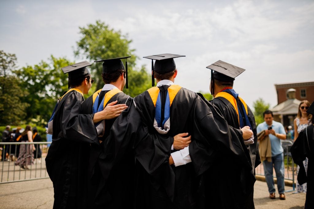 A group of graduates takes a picture at Georgetown