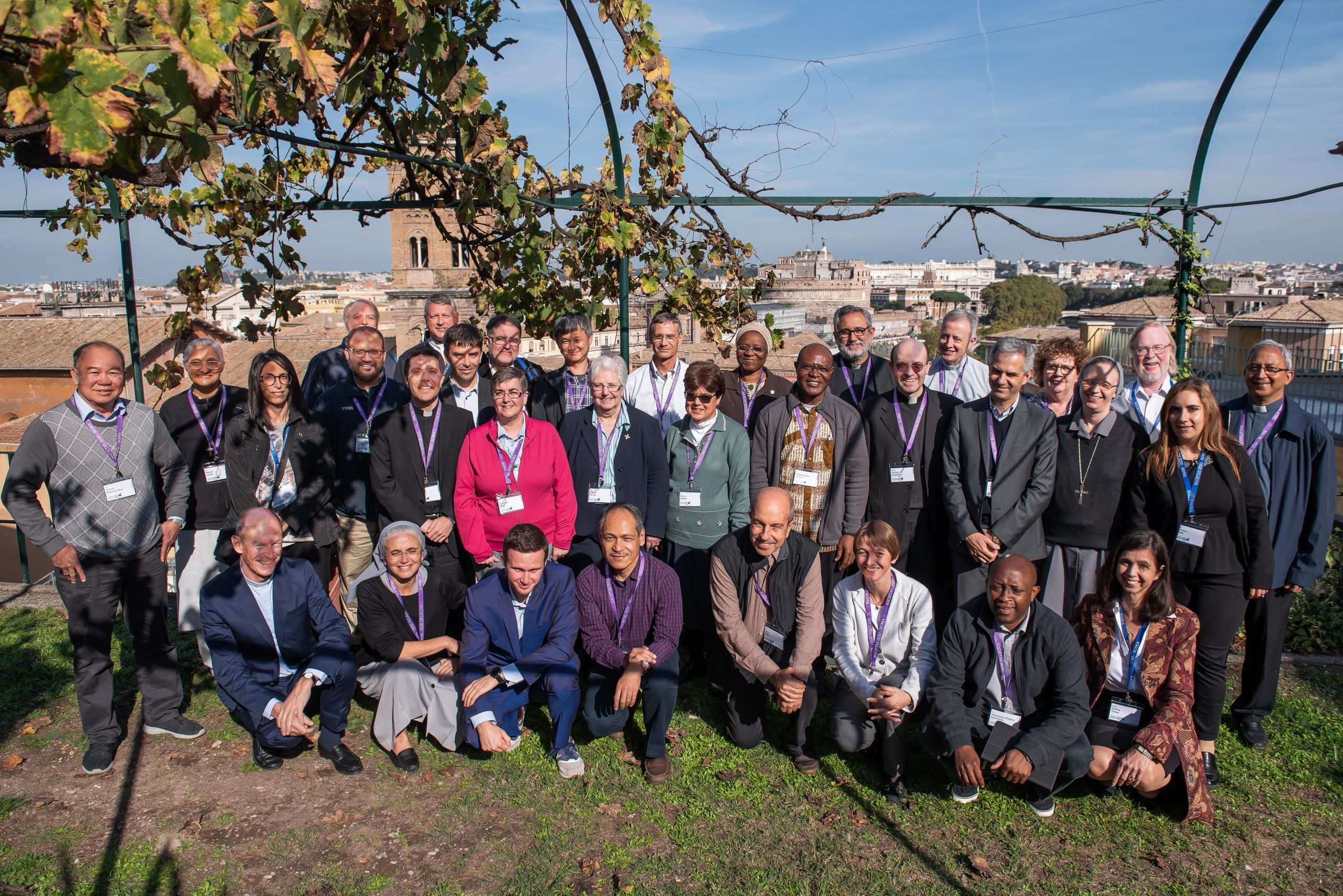 Students and professors in a group photo of about 30 people