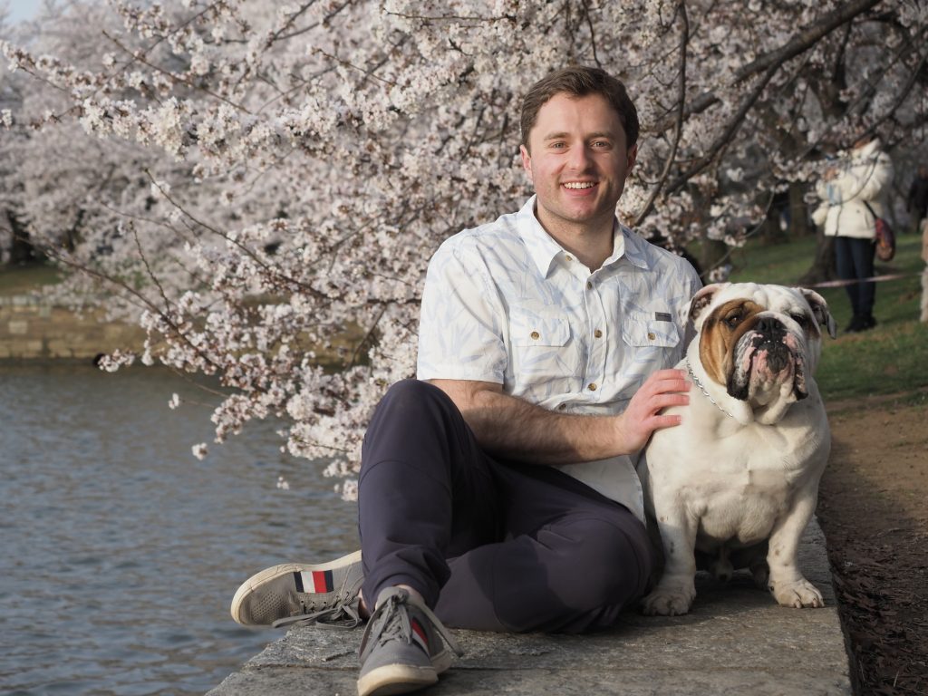Kirk and Jack in front of blooming cherry blossom trees