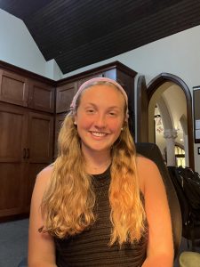 An image of student Abby Omaña (SFS’24) in the sacristy of Dahlgren Chapel.