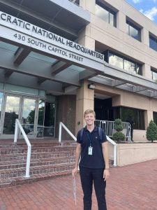 Jackson Mittleman (C'23) stands in front of the Democratic Committee's national headquarters in Washington, DC.