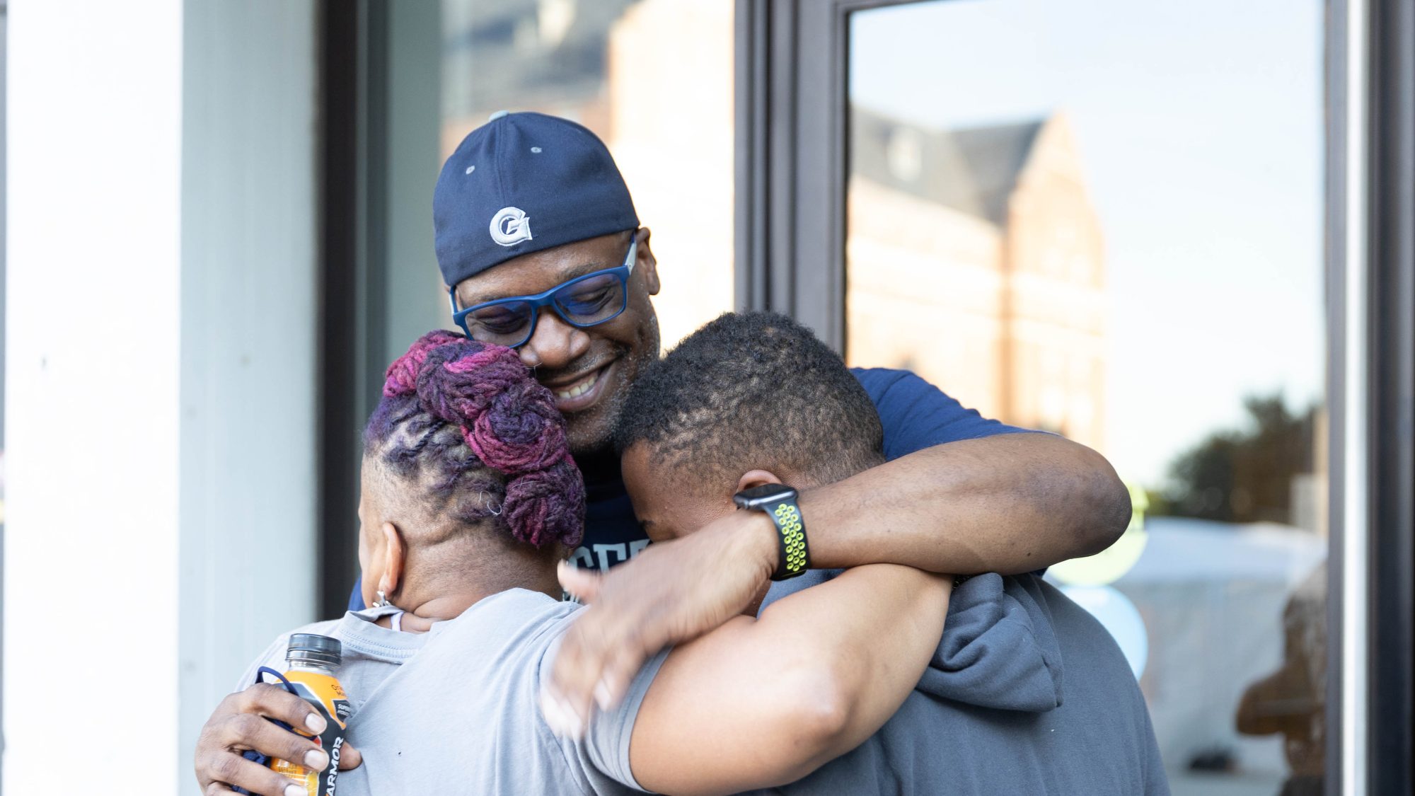 A family embraces during move-in weekend