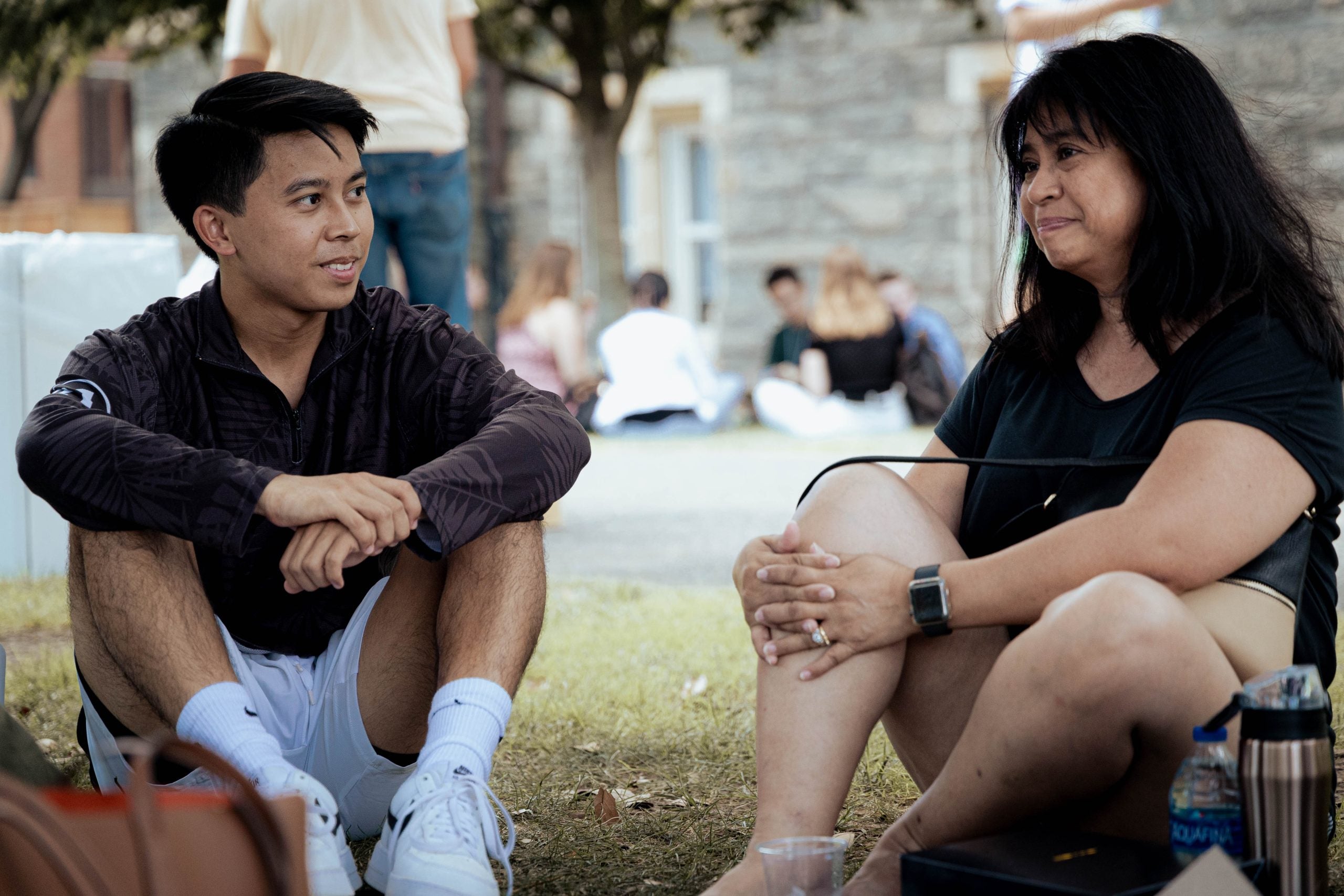 Wyatt Nako watches as his mother, Judy Nako, tears up while she speaks about his moving to Georgetown, far away from their home in Hawaii.