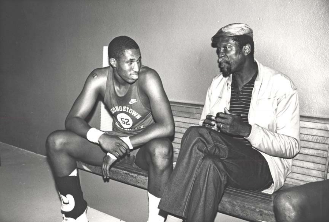 Bill Russell sits next to Ralph Dalton in a black and white photograph