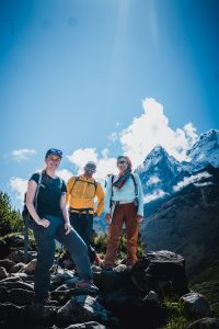 Sarah Watson, a senior in SFS, hikes in a valley in Nepal with the mountain, Cholatse Peak, in the background.