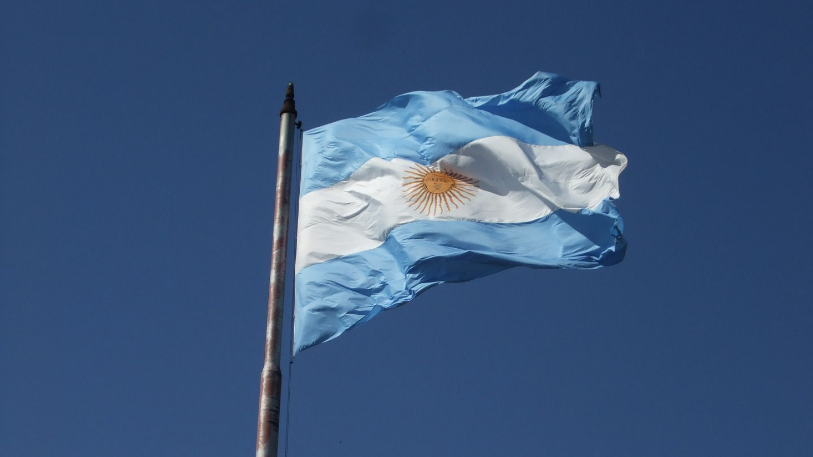 Argentina Flag against a blue sky