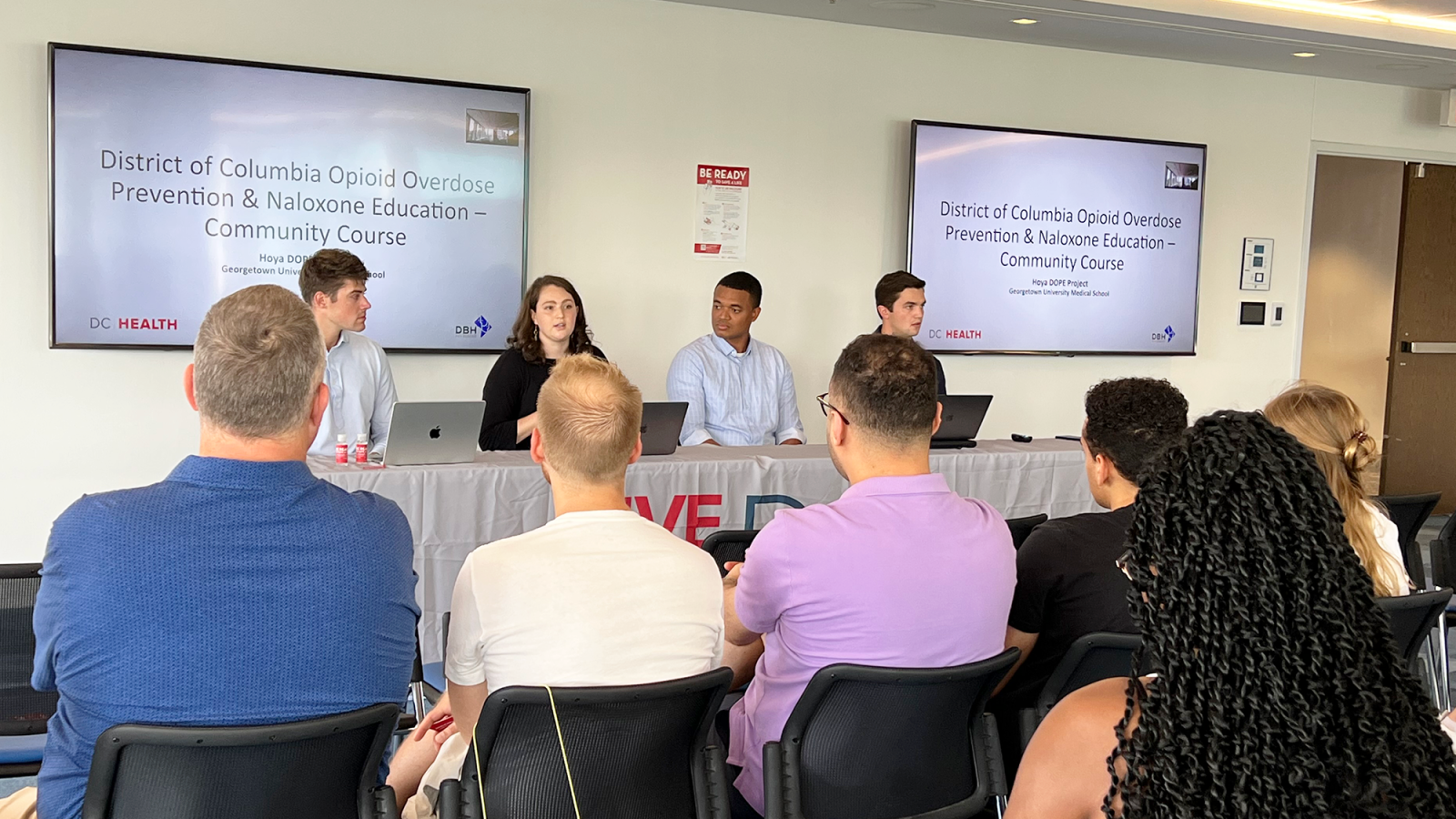 Four medical students trained about 20 attendees on how to use naloxone through a nasal spray.