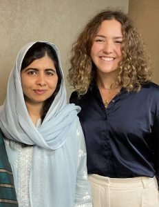 Alara wearing a black blouse next to Malala Yousafzai wearing a light blue hijab