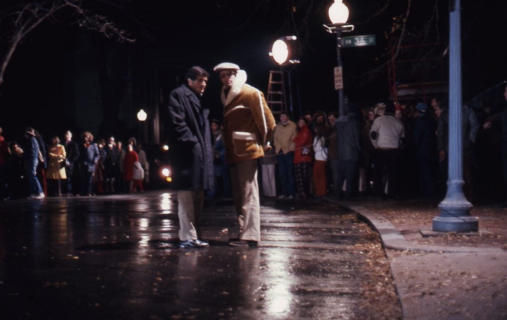 The director of The Exorcist and actor Jason Miller discuss a scene on the streets of the Georgetown neighborhood