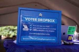 A blue box that has a sticker on it that says "Voter Dropbox" with instructions for how voters can drop off their voter registration.