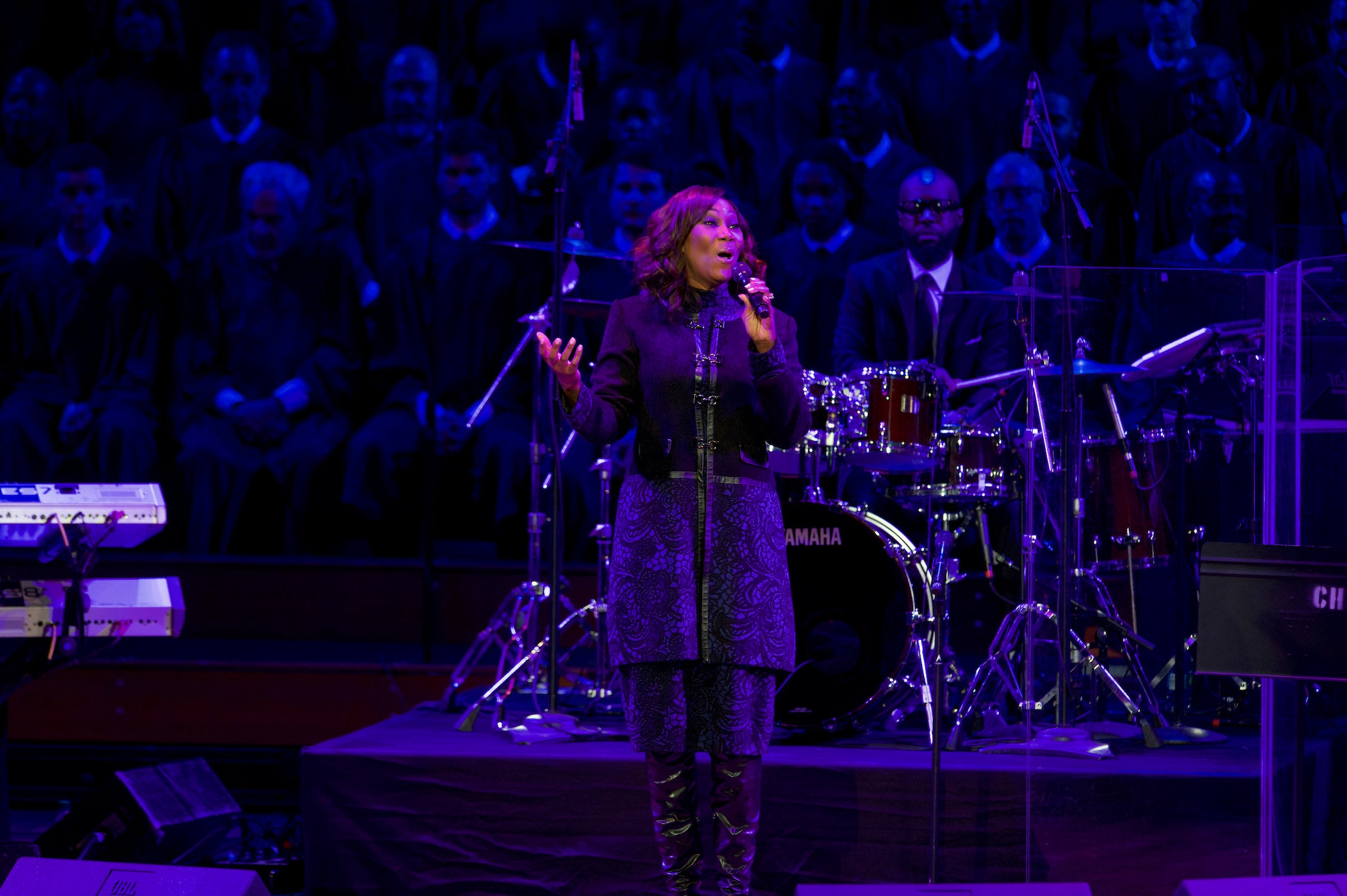 Yolanda Williams performs in front of a drum kit