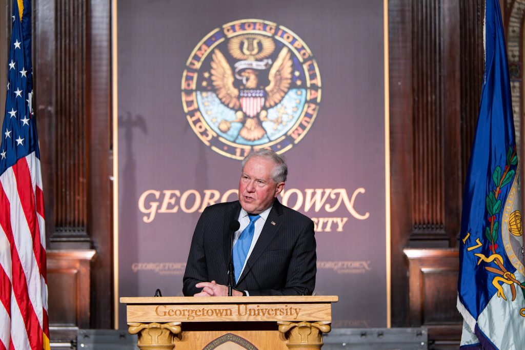 Frank Kendall speaks from behind a podium onstage in front of a Georgetown University sign