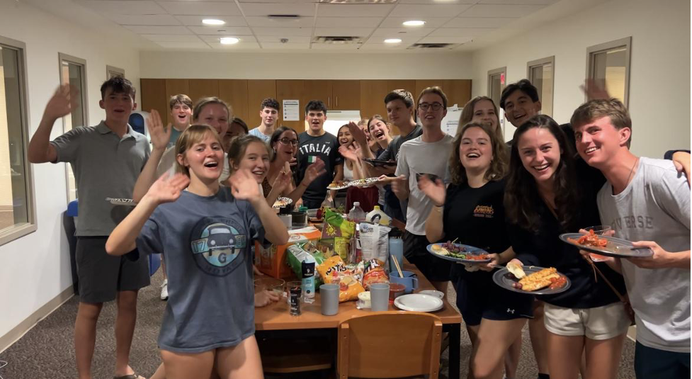 Students posing with snacks