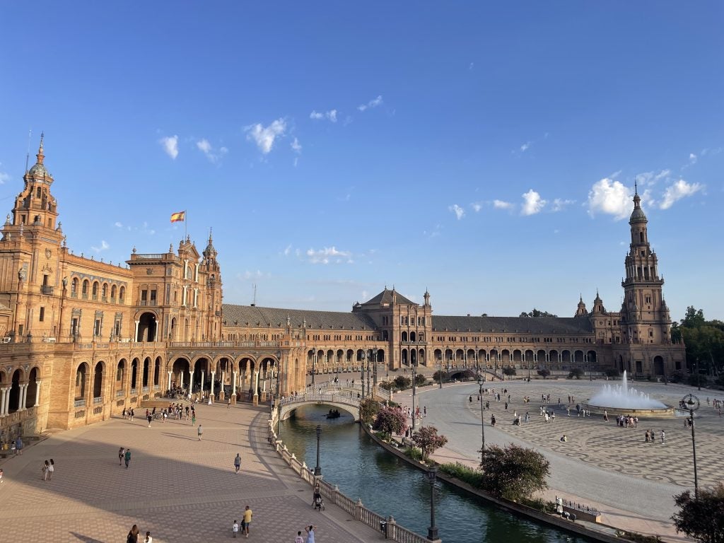 Wide angle of sunset on a building in Seville, Spain