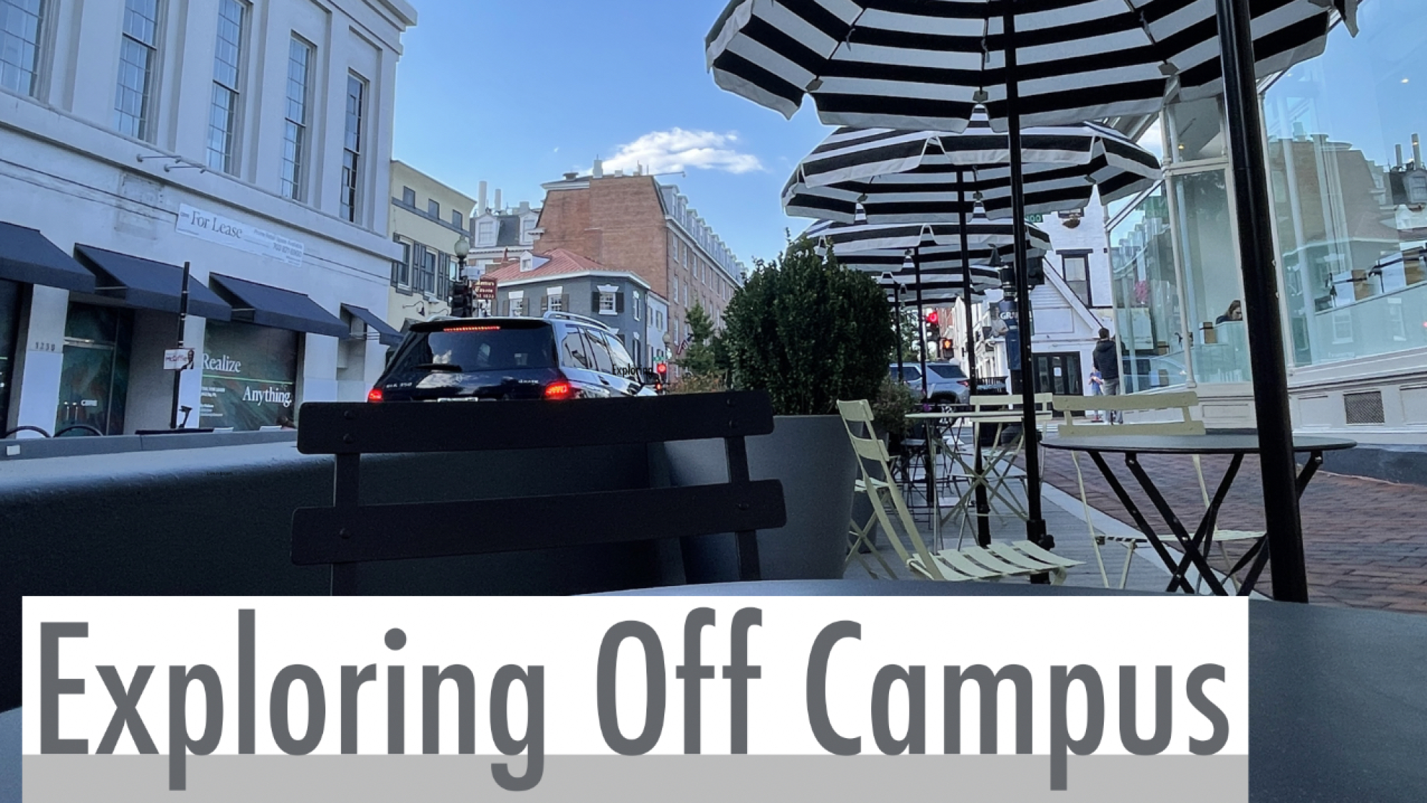 A photo of M street businesses in Georgetown, Washington DC. A graphic in the bottom of the photo reads: &quot;Exploring Off Campus&quot; in gray letters