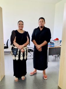 Lavinia Taumoepeau-Latu (G’23) (left) stands next to the head of division for local government in Tonga, Manase Foukimoana. She wears a black dress and traditional waist dressing, which is required for women upon entering government buildings or working in government, she says.