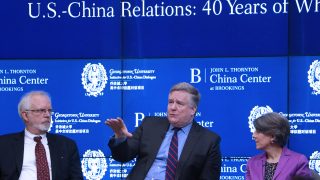 Professor Dennis Wilder, a former CIA China analyst, speaks on stage at an event.