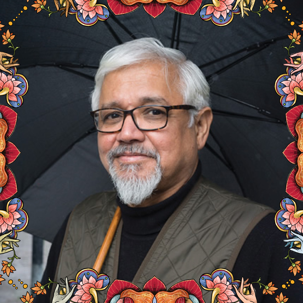 Amitav Gosh, holding umbrella; a decorative frame sits around image.