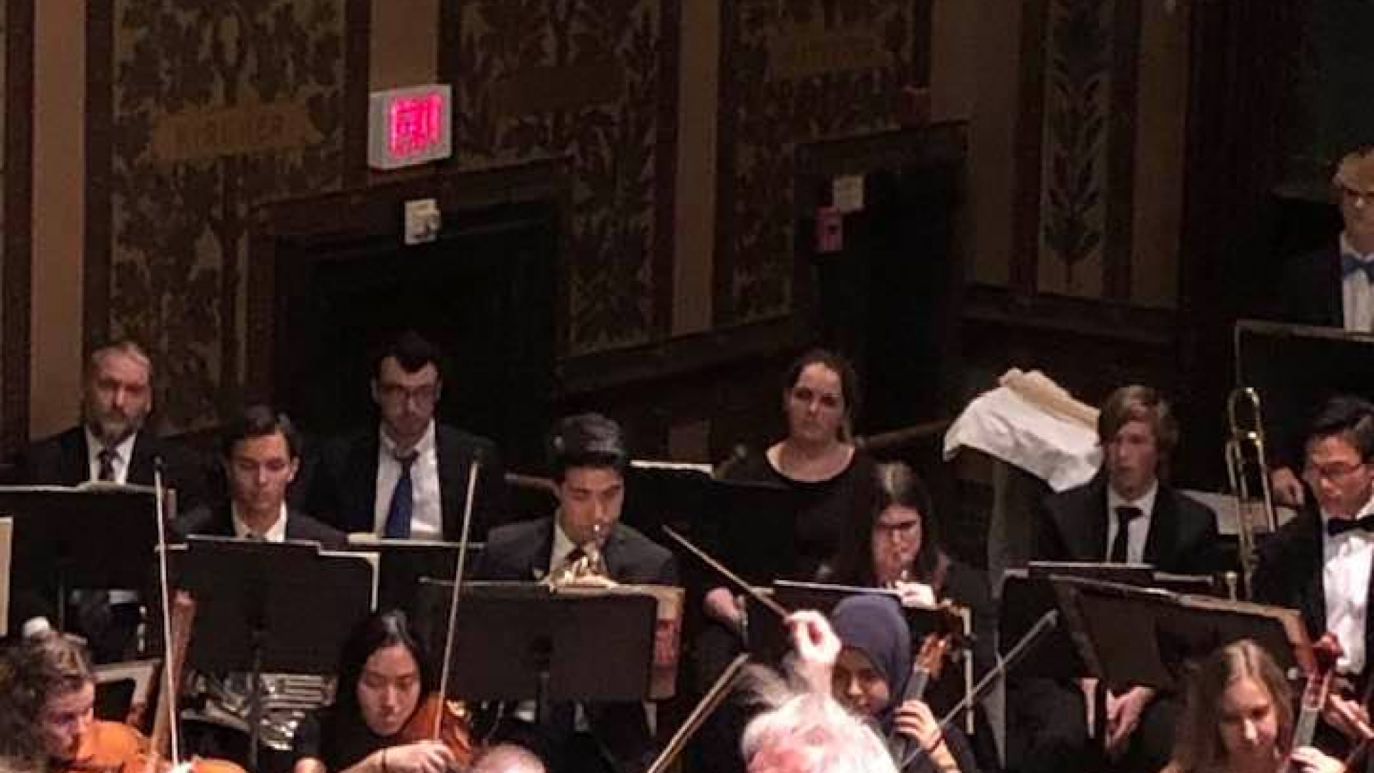 Orchestra performing in Gaston Hall.