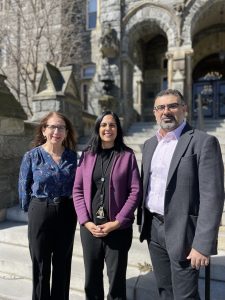 Three professors leading the Massive Data and Displacement project stand outside Healy Hall on a sunny day in March. They are (from left to right) Katharine Donato, Donald Herzberg Professor of International Migration; Lisa Singh, director of Georgetown’s Massive Data Institute; and Ali Arab, associate professor of statistics. 