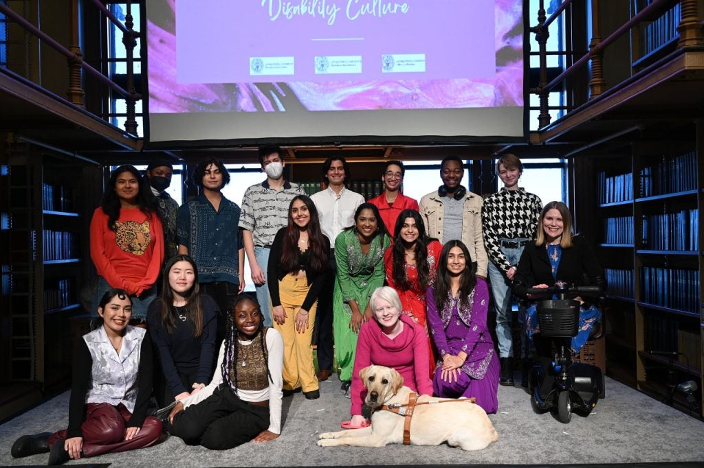 The event's student performers and Dr. Amy Kenny pose in Riggs Library