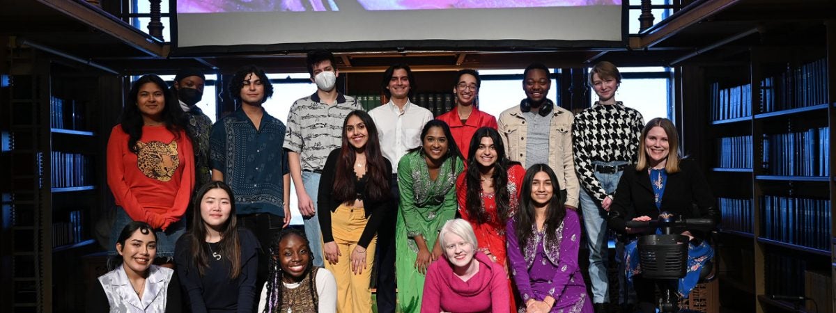 The event's student performers and Dr. Amy Kenny pose in Riggs Library