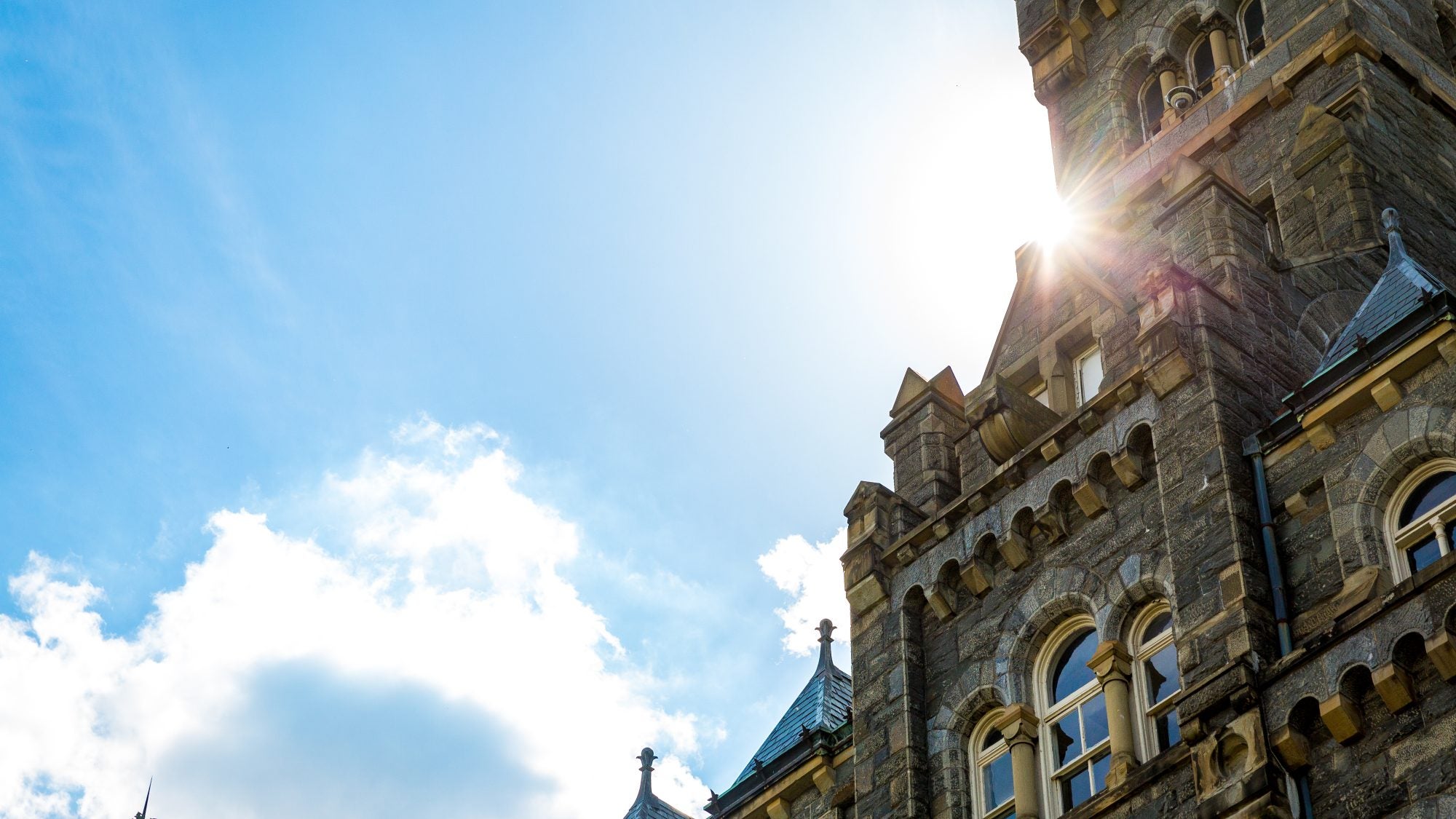 A shot of the top of Healy Hall on a sunny day