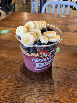 purple acai bowl with blueberries and bananas